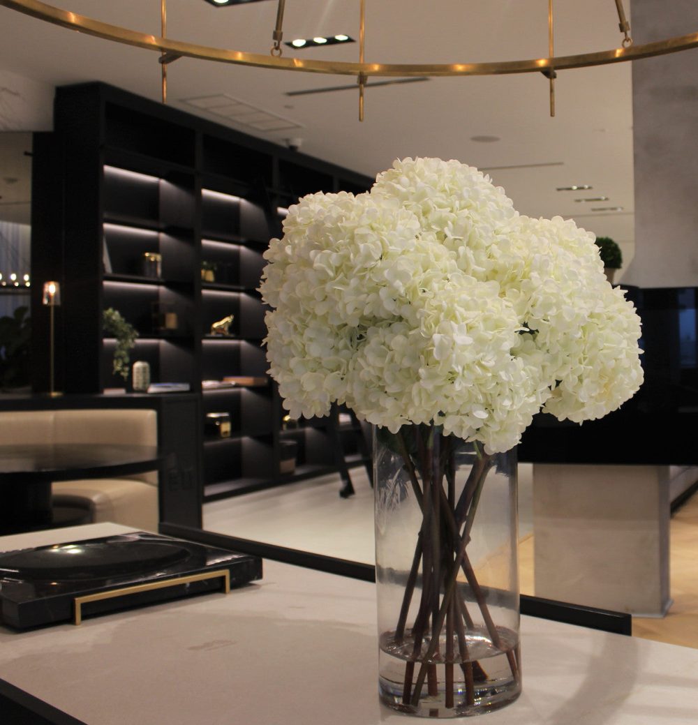 White Hydrangea Bouquet in clear tall glass cylinder vase - Image 2